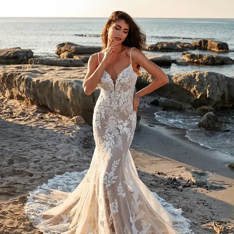 Model wearing a white gown by Eddy K