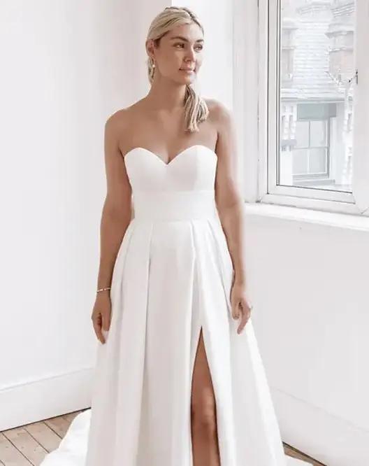 Model wearing a white gown