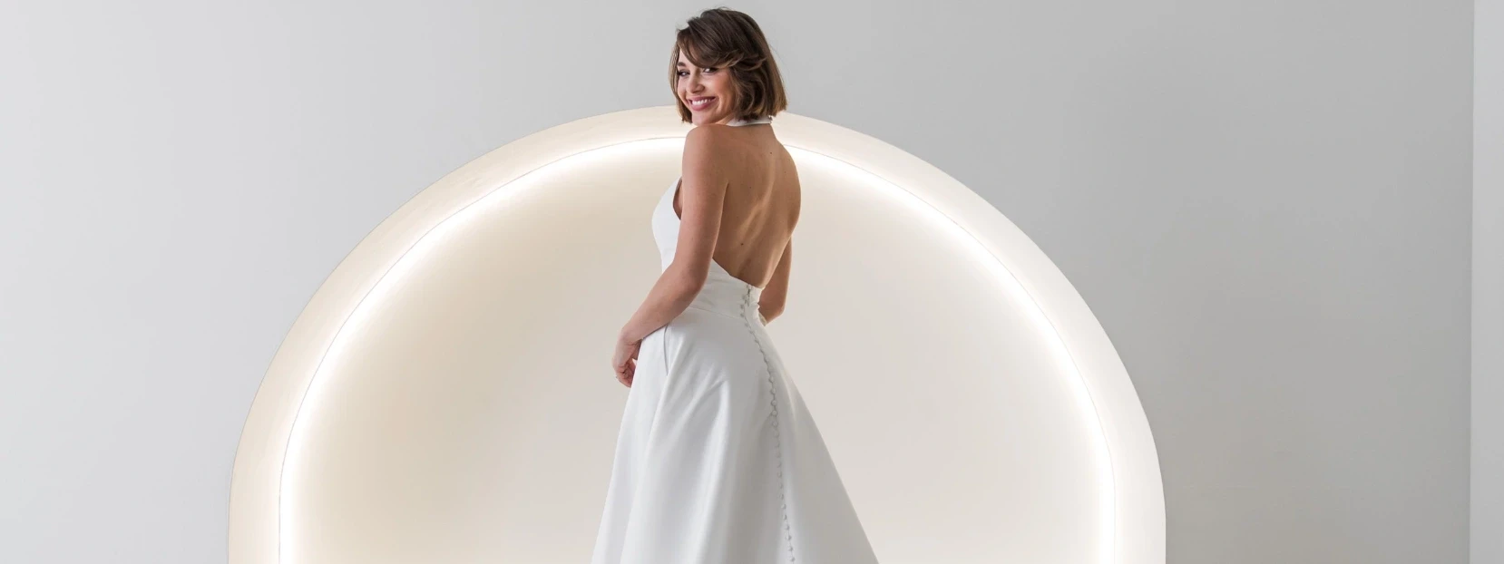 Model wearing a white gown by Fox Bridal